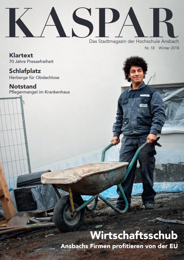 Cover Ausgabe 18: Junger Mann mit Schubkarre